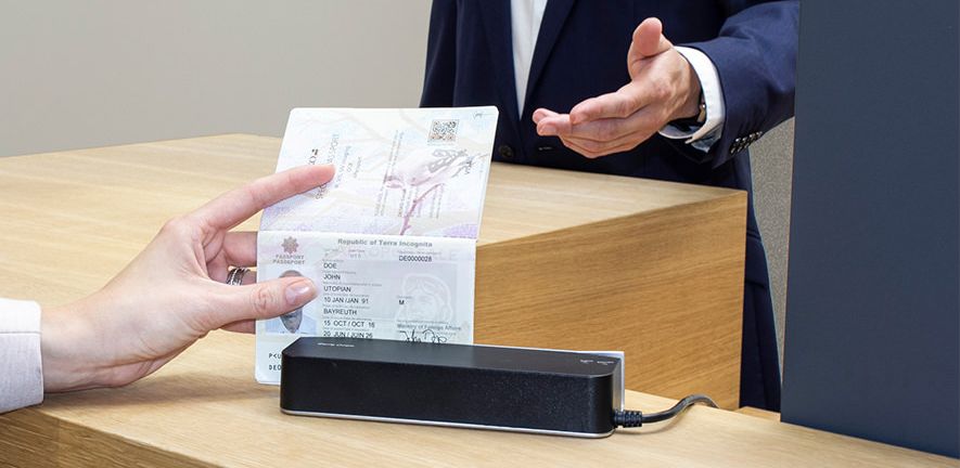Woman at self-check-in using a code on her smartphone.